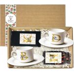 Otwarty box z dwiema filiżankami 150 ml, kawą mieloną i herbatą liściastą